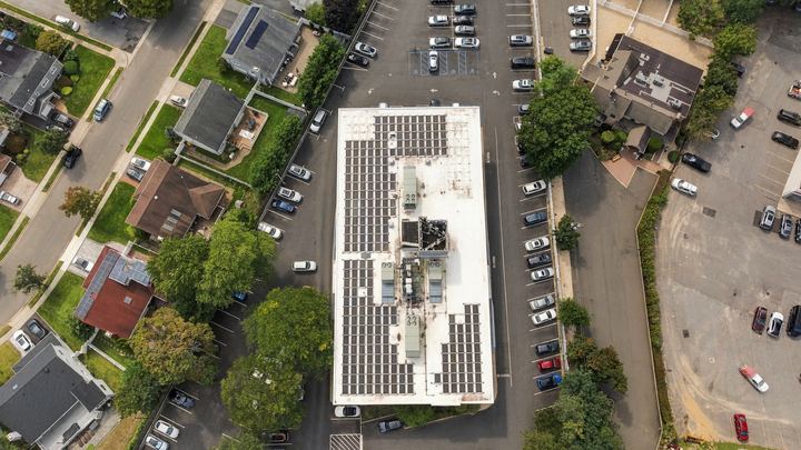 Overhead view of rooftop solar and parking